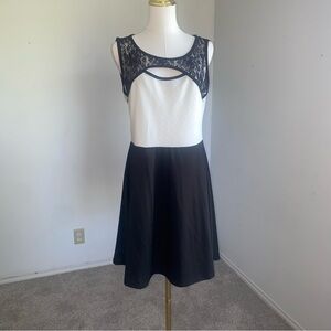 Elegant black and white fit-and-flare dress by Vibe Sportswear.